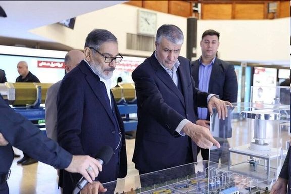 Ali Shamkhani, the former secretary of the Supreme National Security Council, and Mohammad Eslami, the director of the Atomic Energy Organization of Iran, during an expo on the country’s nuclear program in Tehran (February 2025)