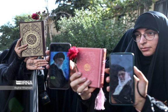 A regime-sponsored rally against the burning of the Quran