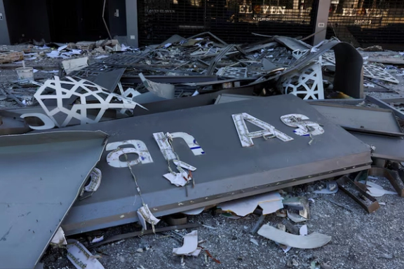 Debris lies at the site of a damaged branch of Al-Qard al-Hassan', a financial institution linked to Lebanon's Hezbollah in Beirut suburbs, Lebanon, October 21, 2024.
