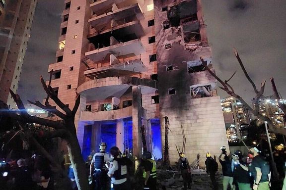 Magen David Adom paramedics attend to the site of an Iranian ballistic missile attack in Petah Tikva in central Israel, June 16, 2025.