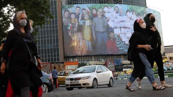 A banner of the presidential election is seen in Valiasr square in Tehran on June 16, 2021.
