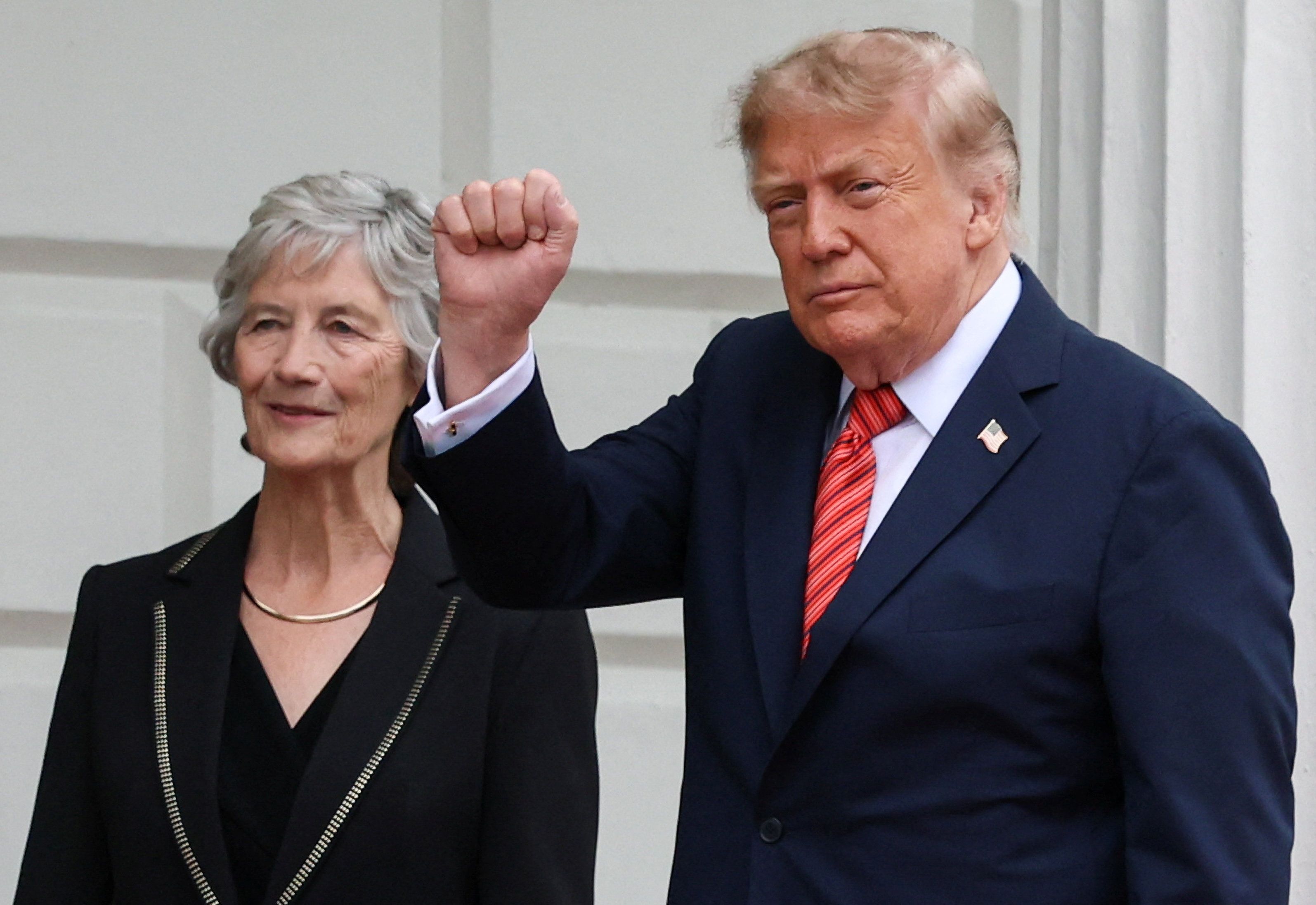 US President Donald Trump raises his fist as he meets Irish President Catherine Connolly at Aras an Uachtarain, in Dublin, Ireland, September 12, 2026.