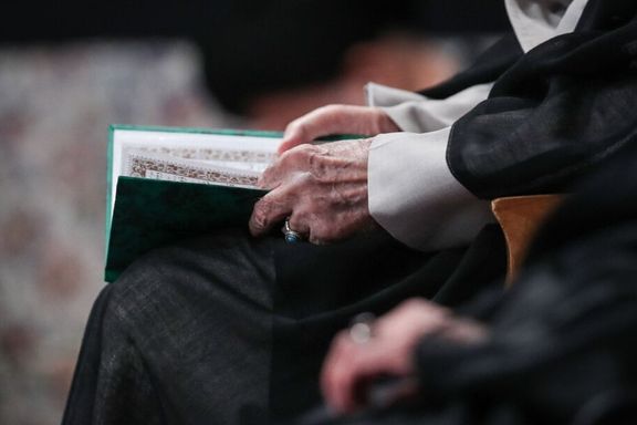A close view of the hands of Iran's supreme leader Ali Khamenei holding a prayers book during an event to commemorate those killed by Israeli strikes, Tehran, Iran, July 29, 2025