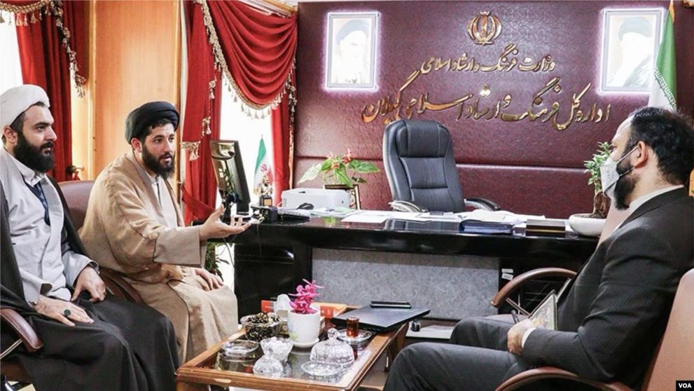 Iranian cleric Mehdi Haghshenas (2nd left) and Reza Seqati, the former director of Iran's Ministry of Culture and Islamic Guidance in Gilan province, during a meeting  