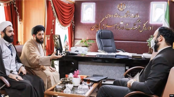Iranian cleric Mehdi Haghshenas (2nd left) and Reza Seqati, the former director of Iran's Ministry of Culture and Islamic Guidance in Gilan province, during a meeting