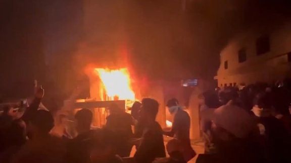 A video grab showing rioters setting Kurdish party headquarters on fire. March 27, 2022