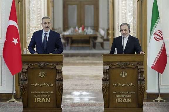 Turkey's Foreign Minister Hakan Fidan (L) and Iran's Foreign Minister Abbas Araghchi hold a joint press conference in Tehran on November 30, 2025.