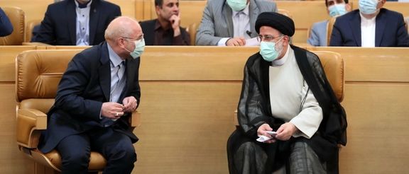 Speaker of the Iranian Parliament Mohammad Bagher Ghalibaf (left) and President Ebrahim Raisi during an event in Tehran