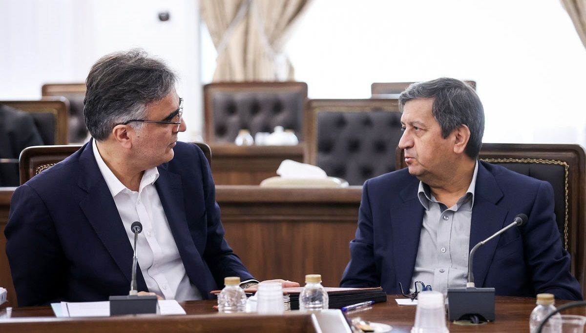 Former head of the Central Bank of Iran Mohammad Reza Farzin (left) and the new chief Abdolnaser Hemmati  