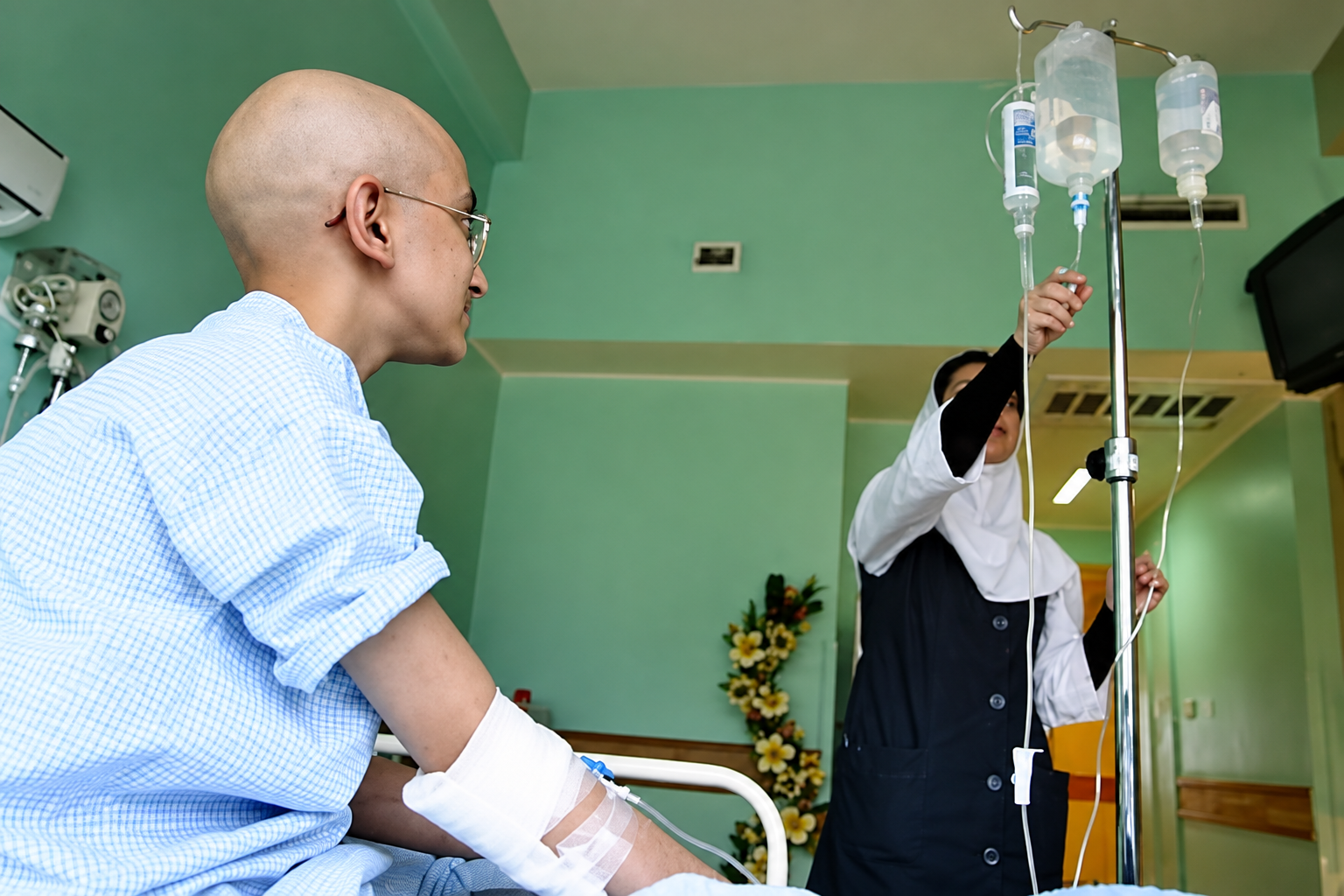 A cancer patient receives treatment at a hospital in Iran.