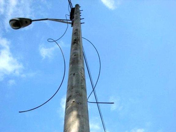 Electricity cables hanging from poles after people cut the resalable wires.