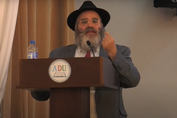 Rabbi Shneor Segal delivers a speech at a Jewish heritage conference held at the Azerbaijan University of Languages on August 30, 2023. (Screenshot via Dahan Center/YouTube)