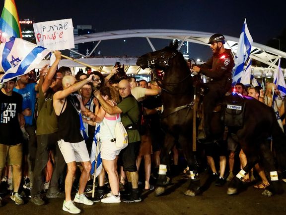 A mounted police officer scuffles with protesters blocking Ayalon Highway during a demonstration following a parliament vote on a contested bill that limits Supreme Court powers to void some government decisions, in Tel Aviv, Israel July 24, 2023.