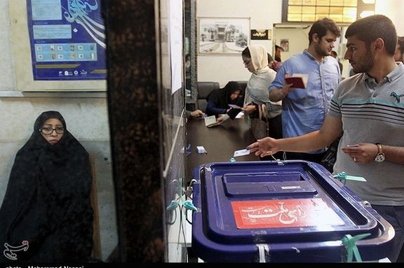 A file photo of Iranians voting in an election