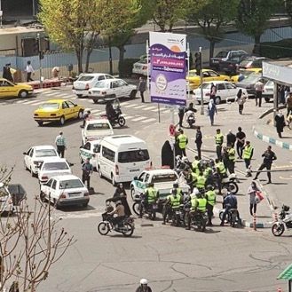 Hijab police vans and agents on motorbikes at a Tehran square (April 2024)