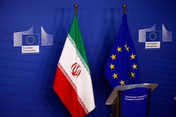 The flags of Iran and the EU