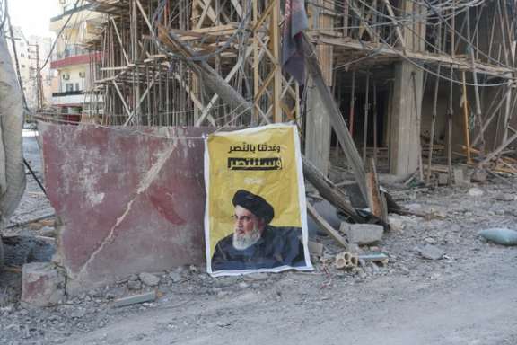 A sign featuring an image of late Hezbollah leader Sayyed Hassan Nasrallah is displayed, following Israeli strikes, amid the ongoing hostilities between Hezbollah and Israeli forces, in Tyre, southern Lebanon, October 23, 2024.