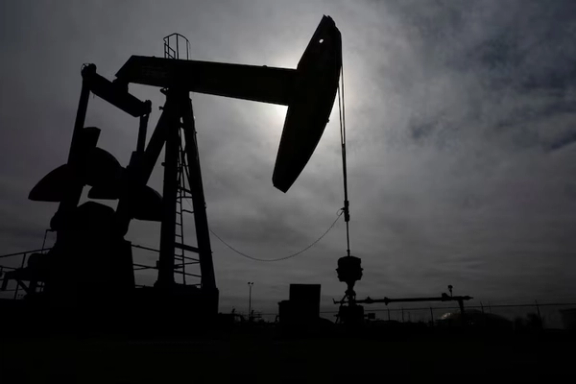 A pump jack operates near a crude oil reserve in the Permian Basin oil field near Midland, Texas, US February 18, 2025.