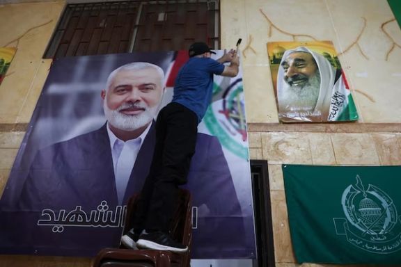 A man hangs a picture of Hamas leader Ismail Haniyeh who was assassinated early on Wednesday morning in Iran, at Burj al-Barajneh Palestinian refugee camp in Beirut, Lebanon July 31, 2024.