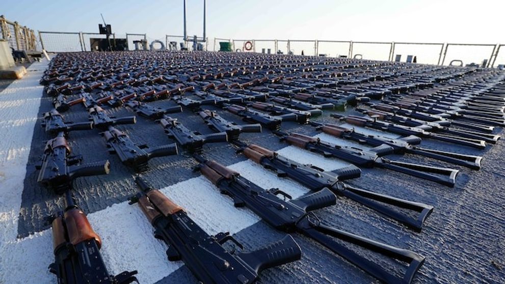 Thousands of AK-47 assault rifles sit on the flight deck of guided-missile destroyer USS The Sullivans (DDG 68) during an inventory process on January 7, 2023.  