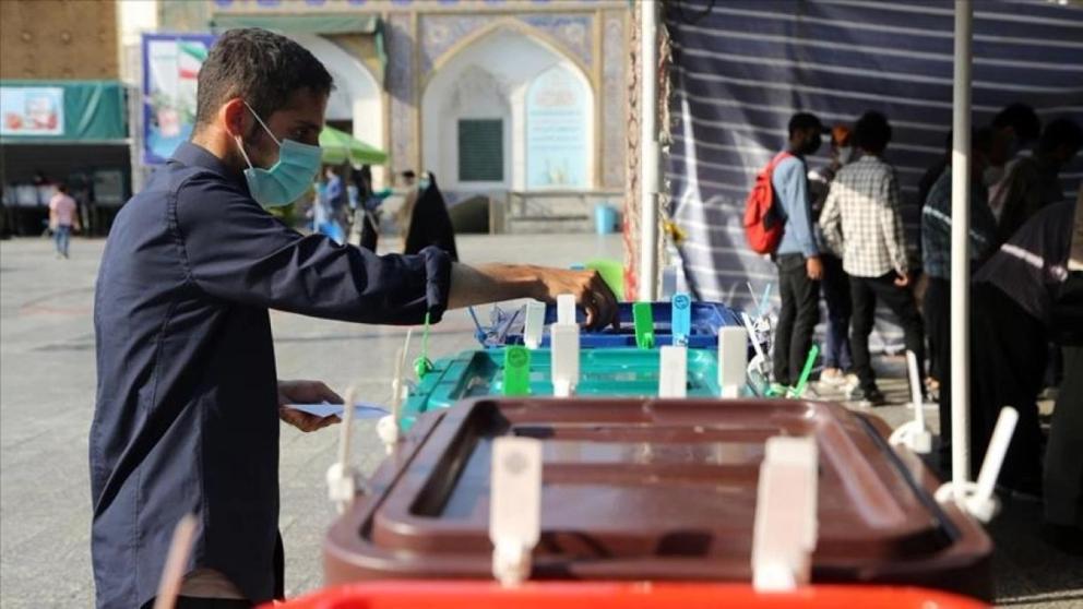 An Iranian man casting his vote in an election 