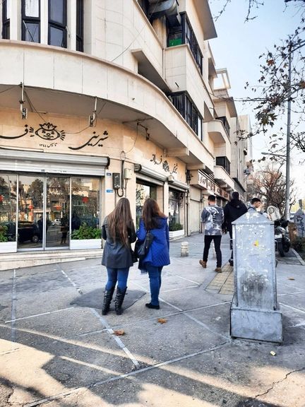 Two Iranian women without hijab in Tehran’s Enghelab street
