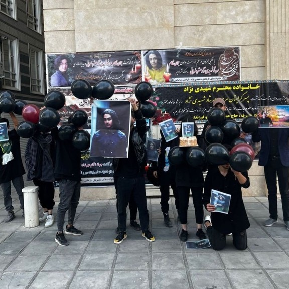 Mourners marking the death of Mehrshad Shahidi