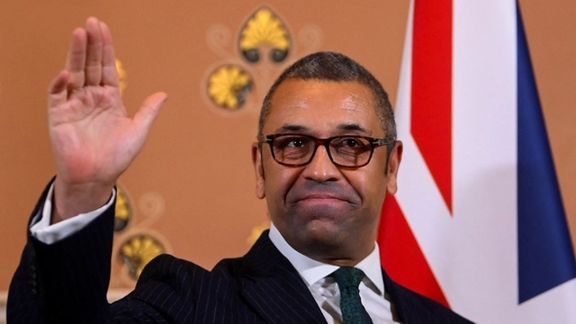 British Foreign Secretary James Cleverly gestures as he speaks to members of the press in London, December 12, 2022