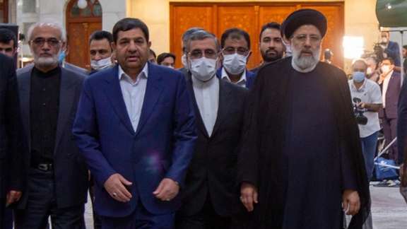 President Ebrahim Raisi with aides pictured in August 2021