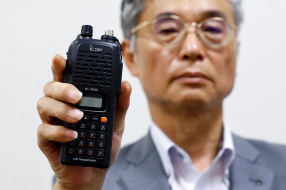 Japanese radio equipment maker Icom Inc director Yoshiki Enomoto shows its model IC-V82 device, which the company said they stopped production in 2014, during an interview at its headquarters in Osaka, Japan, September 19, 2024.