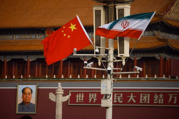 Flags of Iran and China on a mast in Beijing