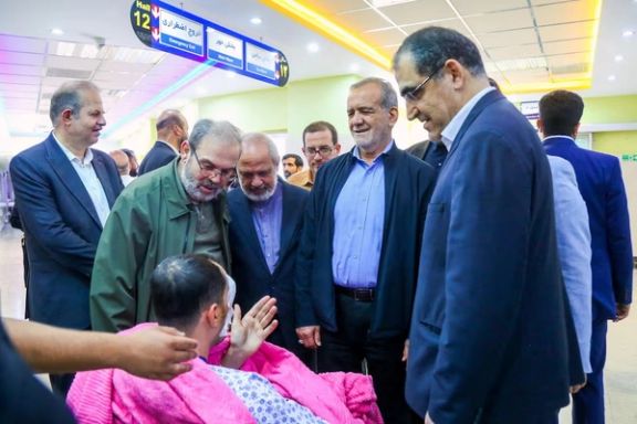 Iran's President Masoud Pezeshkian visits one of the victims injured by pager explosions across Lebanon, in a hospital in Tehran, Iran, September 20, 2024.