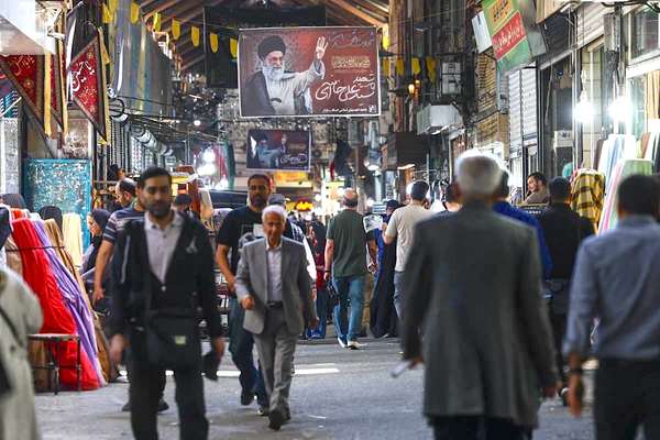As Iran’s economy sinks, hardliners turn to conspiracy
