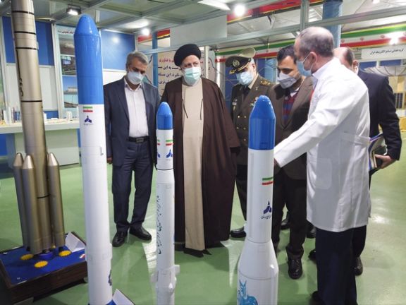 Models of Iran’s satellite launch vehicles on display during a visit by Iranian President Ebrahim Raisi