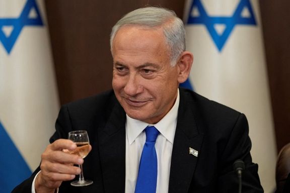 Newly sworn in Israeli Prime Minister Benjamin Netanyahu makes a toast during a cabinet meeting in Jerusalem, December 29, 2022