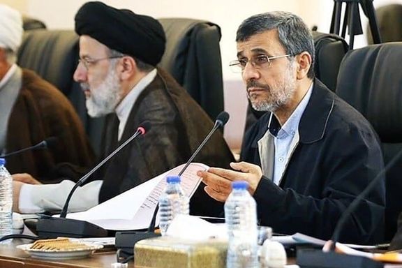 Former Iranian president Mahmoud Ahmadinejad (right) and President Ebrahim Raisi during a session (undated)