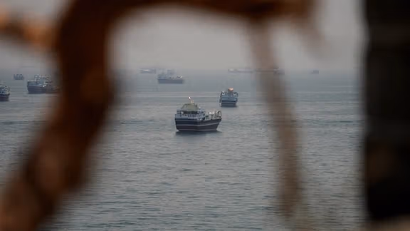 Iran officials threaten Hormuz escalation as Trump says deal is near