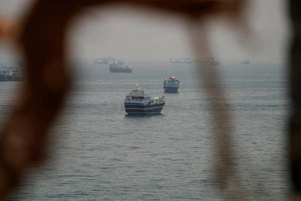 Iran officials threaten Hormuz escalation as Trump says deal is near