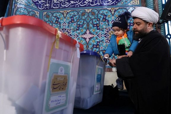 An Iranian cleric casts his vote during parliamentary elections at a polling station in Tehran, Iran, March 1, 2024.