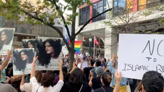 People attend a protest in solidarity with the women in Iran, following the death of Mahsa Amini, in Toronto, Canada, September 19, 2022.