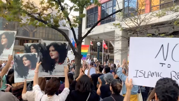 People attend a protest in solidarity with the women in Iran, following the death of Mahsa Amini, in Toronto, Canada, September 19, 2022.