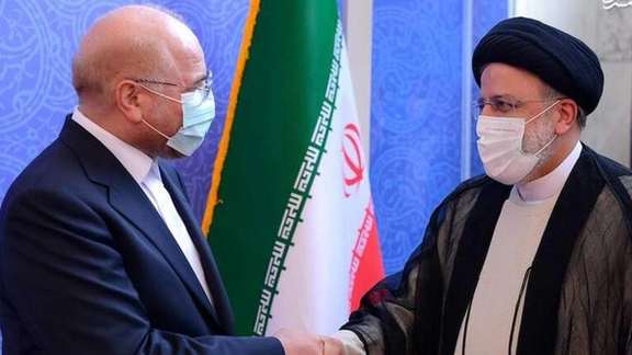 Parliament Speaker Mohammad Bagher Ghalibaf shaking hands with President Ebrahim Raisi