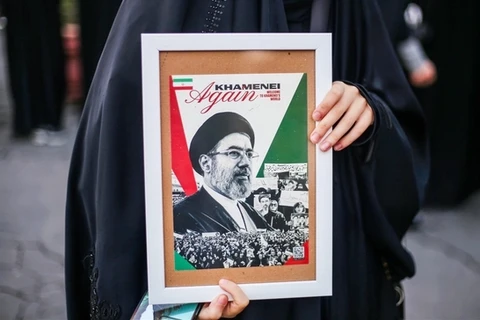 Talks or resistance? Iran's factions differ over path out of crisis