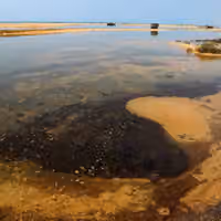 Iran warns oil pollution spreading along southern coast could last years