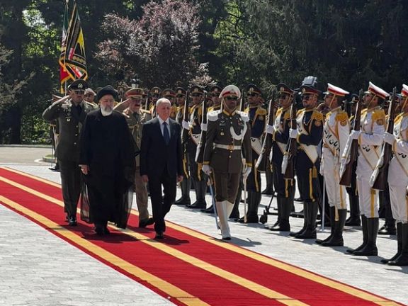 Iraqi President Abdul Latif Rashid and Iranian President Ebrahim Raisi, review an honor guard, during his official arrival ceremony in Tehran, April 29, 2023