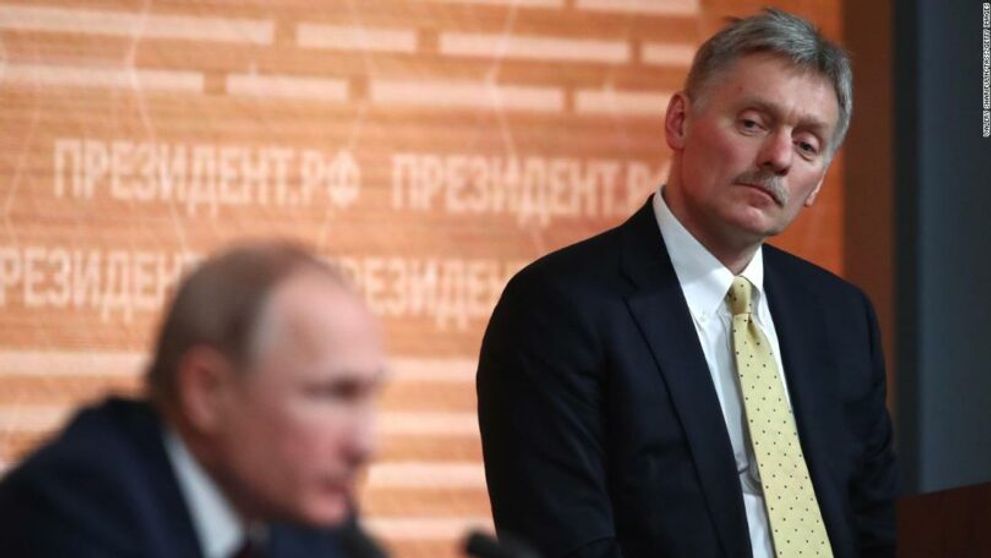 Dmitry Peskov alongside Russian President Vladimir Putin.