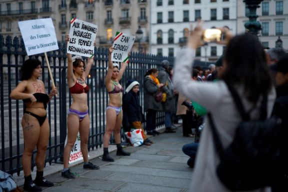 Women in underwear hold placards in support of an Iranian female student, named as Ahoo Daryaei on social media, seen in her underwear at a Tehran university in protest against country's strict Islamic dress code, and all Iranian women who fight for freedom, during a rally in front of the Pantheon in Paris, France, November 5, 2024.