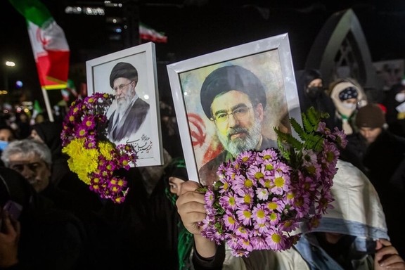 Supporters of the Islamic Republic hold framed pictures of Iran's new supreme leader Mojtaba Khamenei and his slain father Ali, in a rally in northern city of Qazvin, March, 9, 2026