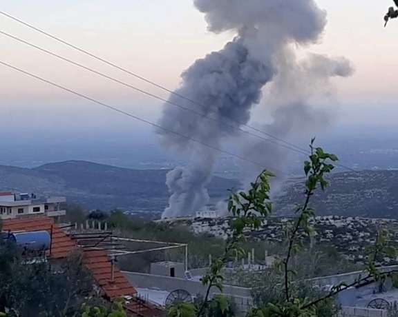 A social media photo of an explosion caused by an Israeli airstrike at a weapons laboratory known to be used by Iran in area of Masyaf in Hama province on April 9, 2022