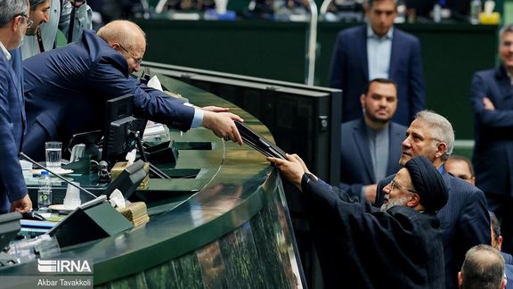 Iranian President Ebrahim Raisi submitting the Seventh Development Plan to Parliament Speaker Mohammad-Bagher Ghalibaf on June 18, 2023
